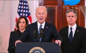 President Biden speaking at podium with Kamala Harris