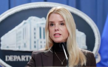 Pam Bondi speaks at DOJ podium