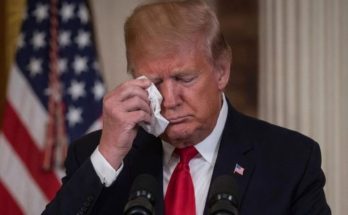 Donald Trump wiping eye with tissue