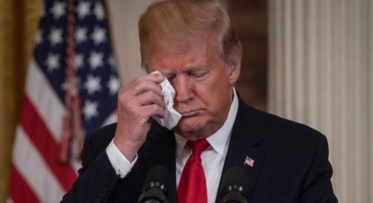 Donald Trump wiping eye with tissue