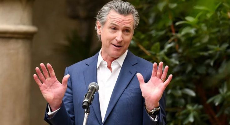 Gavin Newsom speaking with hands raised