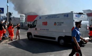 italian emergency ambulance marked 118 and Regione Lazio parked near rising black smoke