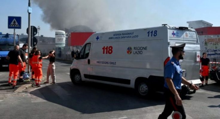 italian emergency ambulance marked 118 and Regione Lazio parked near rising black smoke
