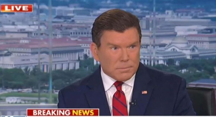 news anchor in dark suit and red striped tie delivering breaking news broadcast with