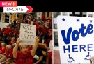 protester in red shirt holds handwritten VOTE them OUT sign beside official Vote Here