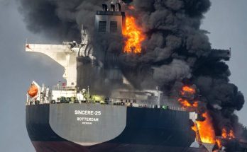 large cargo ship named SINCERE-25 Rotterdam engulfed in flames with thick black smoke