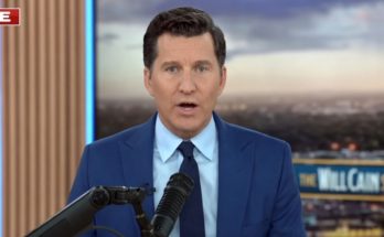 will Cain speaking into microphone during live broadcast of The Will Cain Show