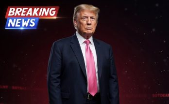 donald Trump in navy suit and pink tie with Breaking News graphic overlay