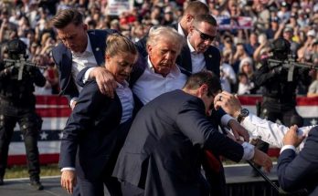 secret Service agents surround Donald Trump after assassination attempt at outdoor rally