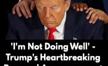 donald Trump with head bowed and hands on his shoulders during emotional moment
