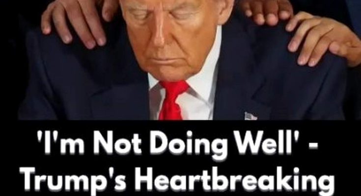 donald Trump with head bowed and hands on his shoulders during emotional moment