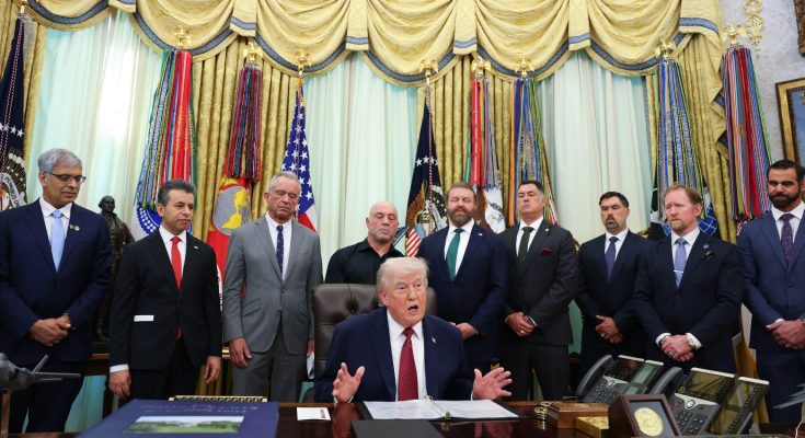 This dramatic image shows the former president speaking at a desk, surrounded by advisors in the Oval Office. He addresses the media, discussing key national issues with a backdrop of