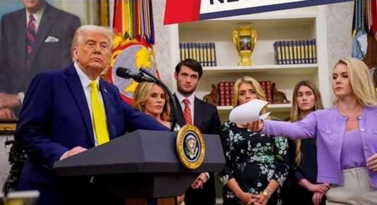 donald Trump stands at presidential podium with family members during official White