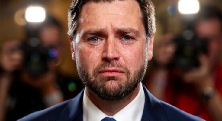 JD Vance with tears on his face during a press event with cameras flashing behind him