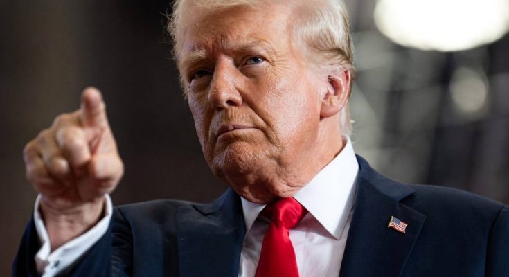donald Trump pointing finger at camera wearing dark suit red tie with THE BEST text
