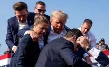 donald Trump surrounded by Secret Service agents during apparent security incident at