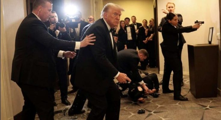 secret Service agents evacuate Donald Trump through hotel hallway with glass debris on
