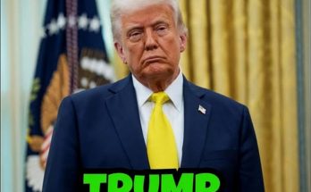donald Trump in navy suit and yellow tie stands before golden curtains with presidential