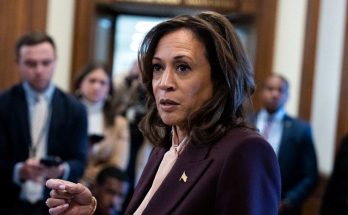 vice President Kamala Harris speaking to reporters in a Capitol hallway with press pool