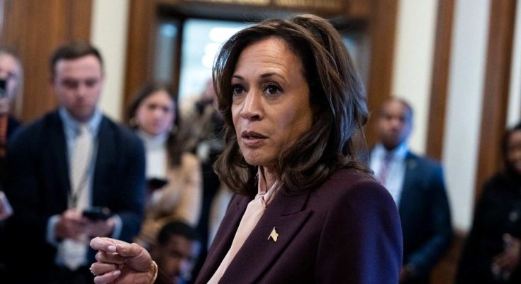 vice President Kamala Harris speaking to reporters in a Capitol hallway with press pool