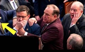 congressman Mike Johnson covers his face with both hands during an emotional moment on