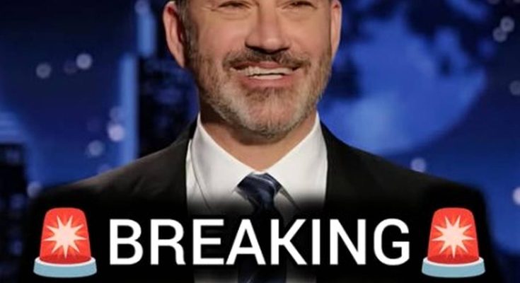 jimmy Kimmel in dark suit with striped tie, smiling against blue globe backdrop with