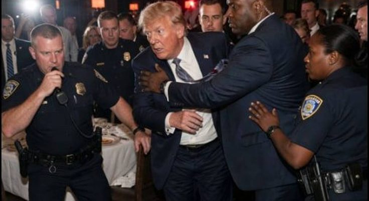 donald Trump being escorted by Secret Service and NYPD officers through crowded hotel